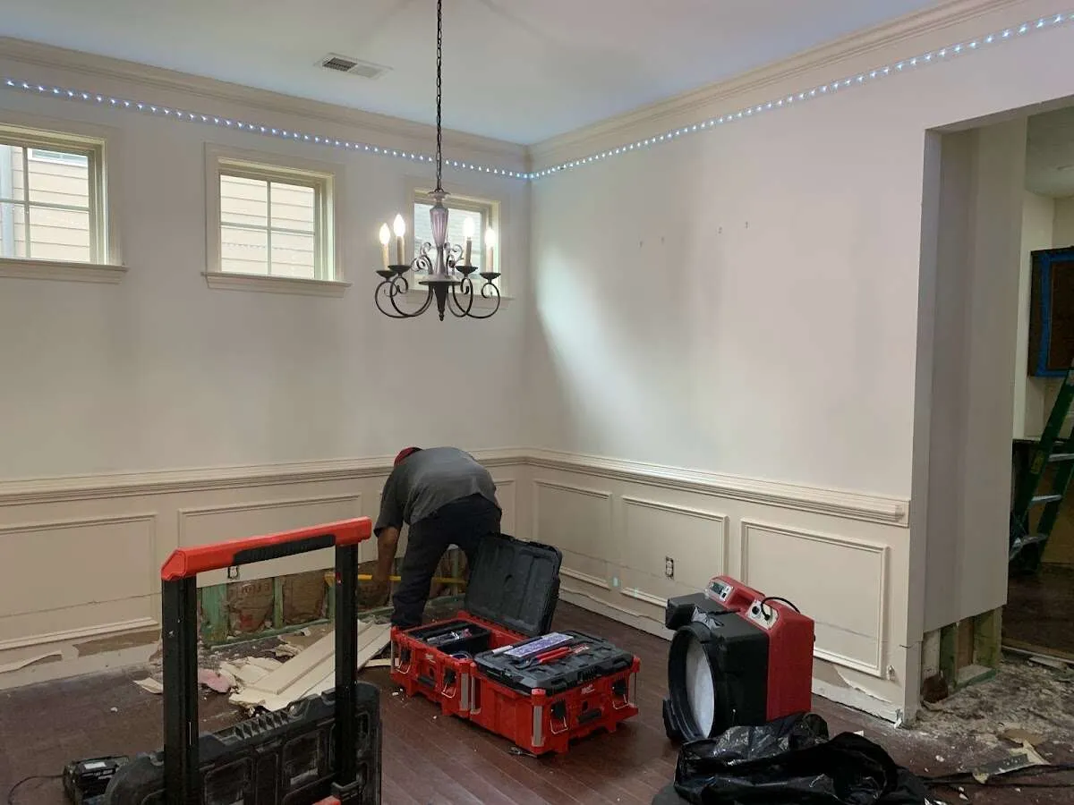 Restoration technician with professional equipment in Quincy